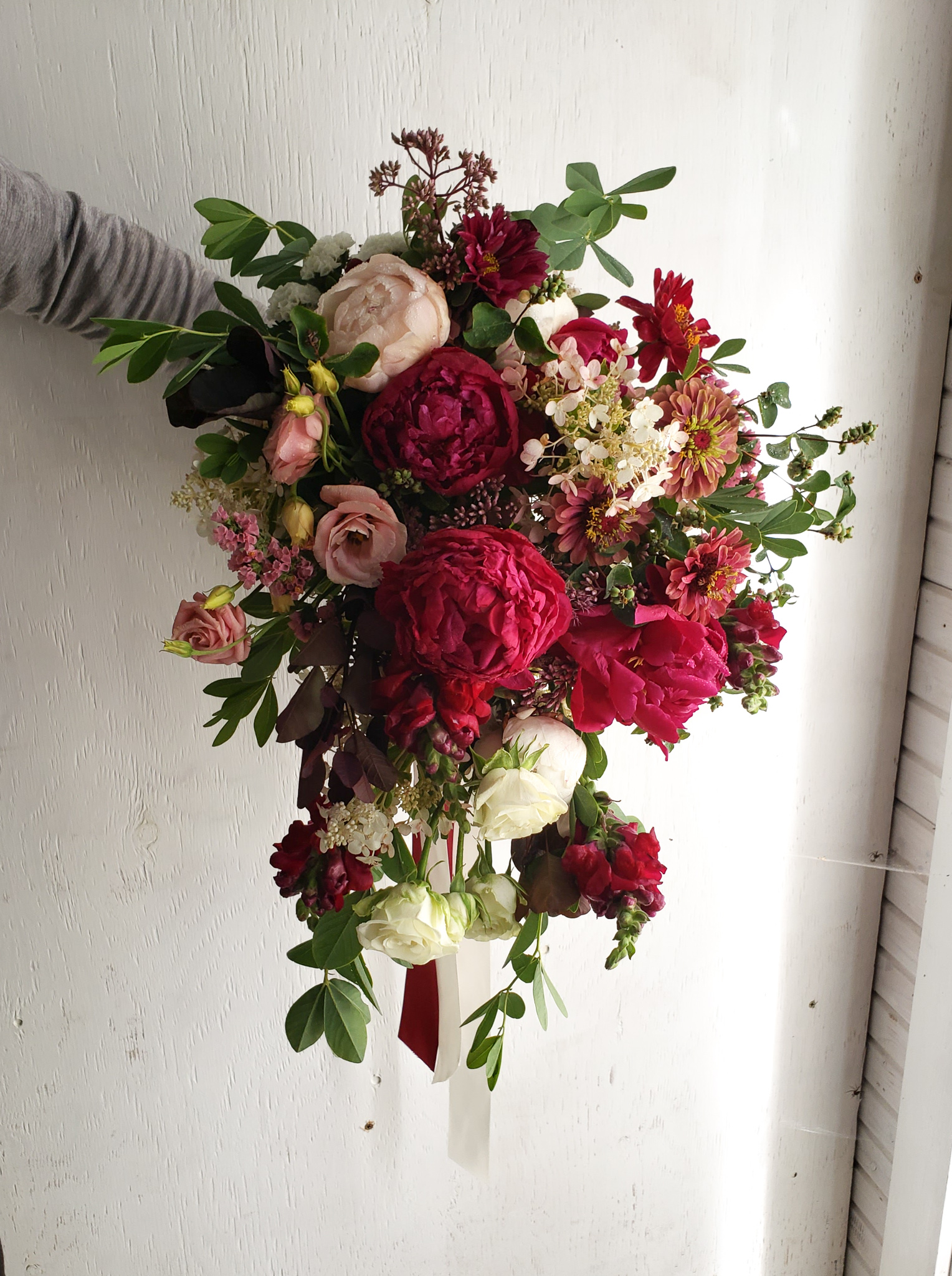 Lush, burgundy cascading bridal bouquet.